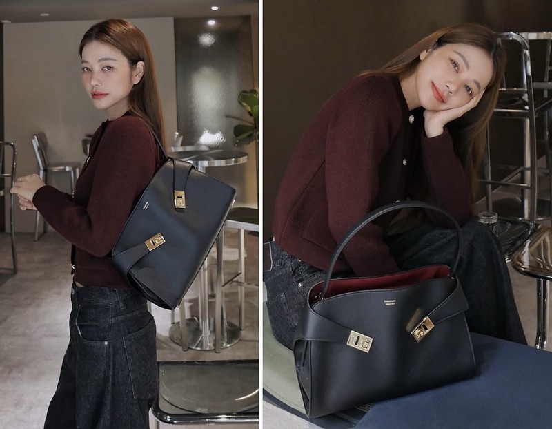 Ferragamo Black/ brown leather Hug M handbag with a curved top handle.