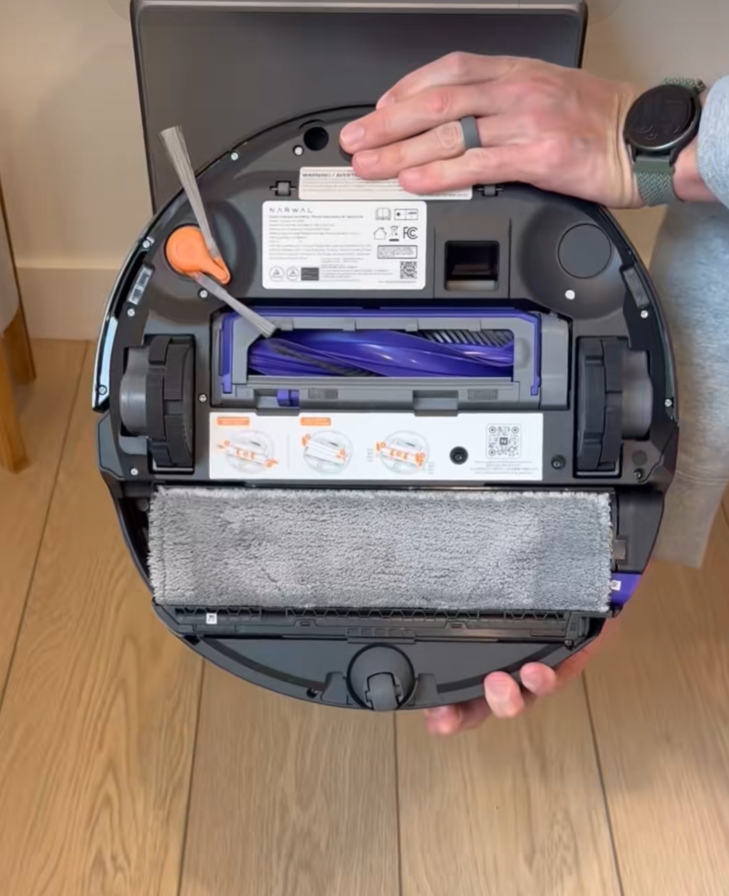 Narwal Flow 2 robot vacuum cleaning a modern studio apartment floor