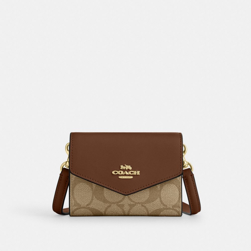 coach mini envelope wallet with strap in signature canvas