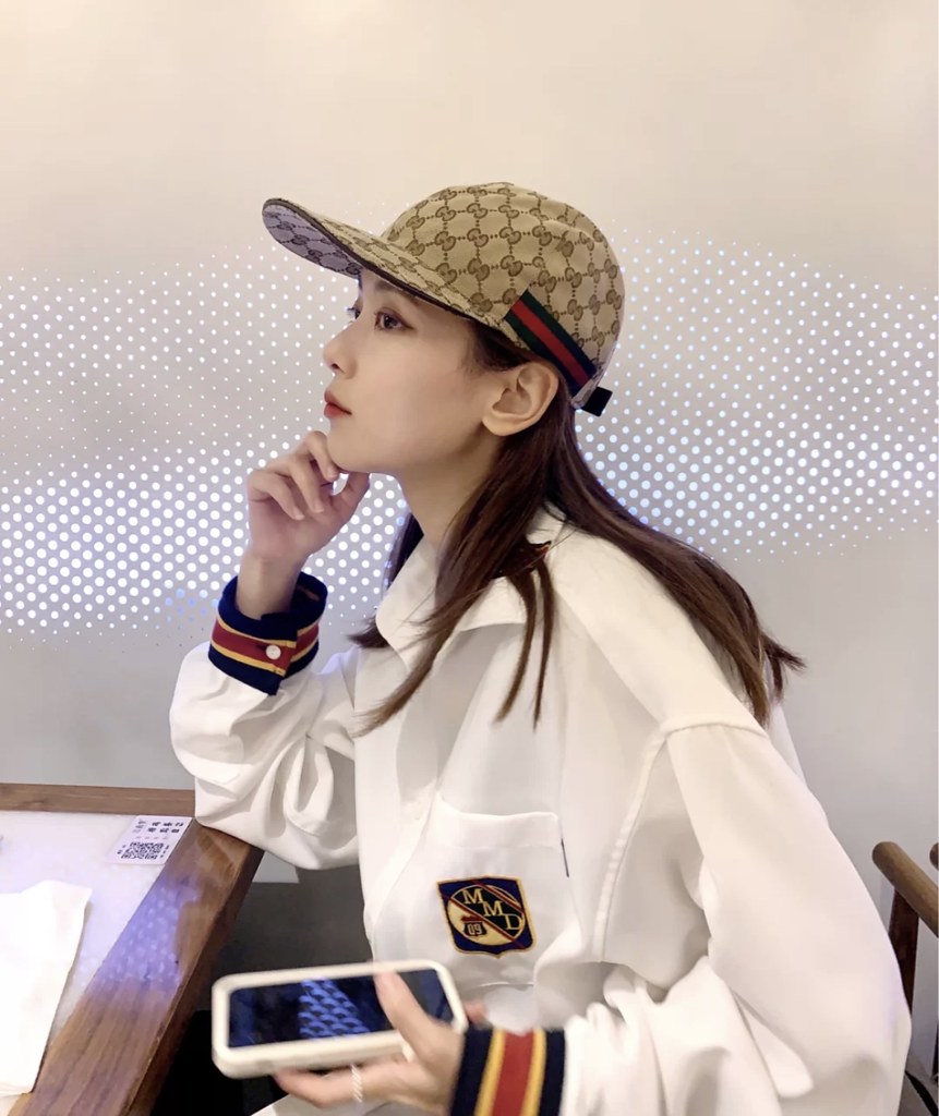 GUCCI Beige GG fabric baseball cap with brown trim.