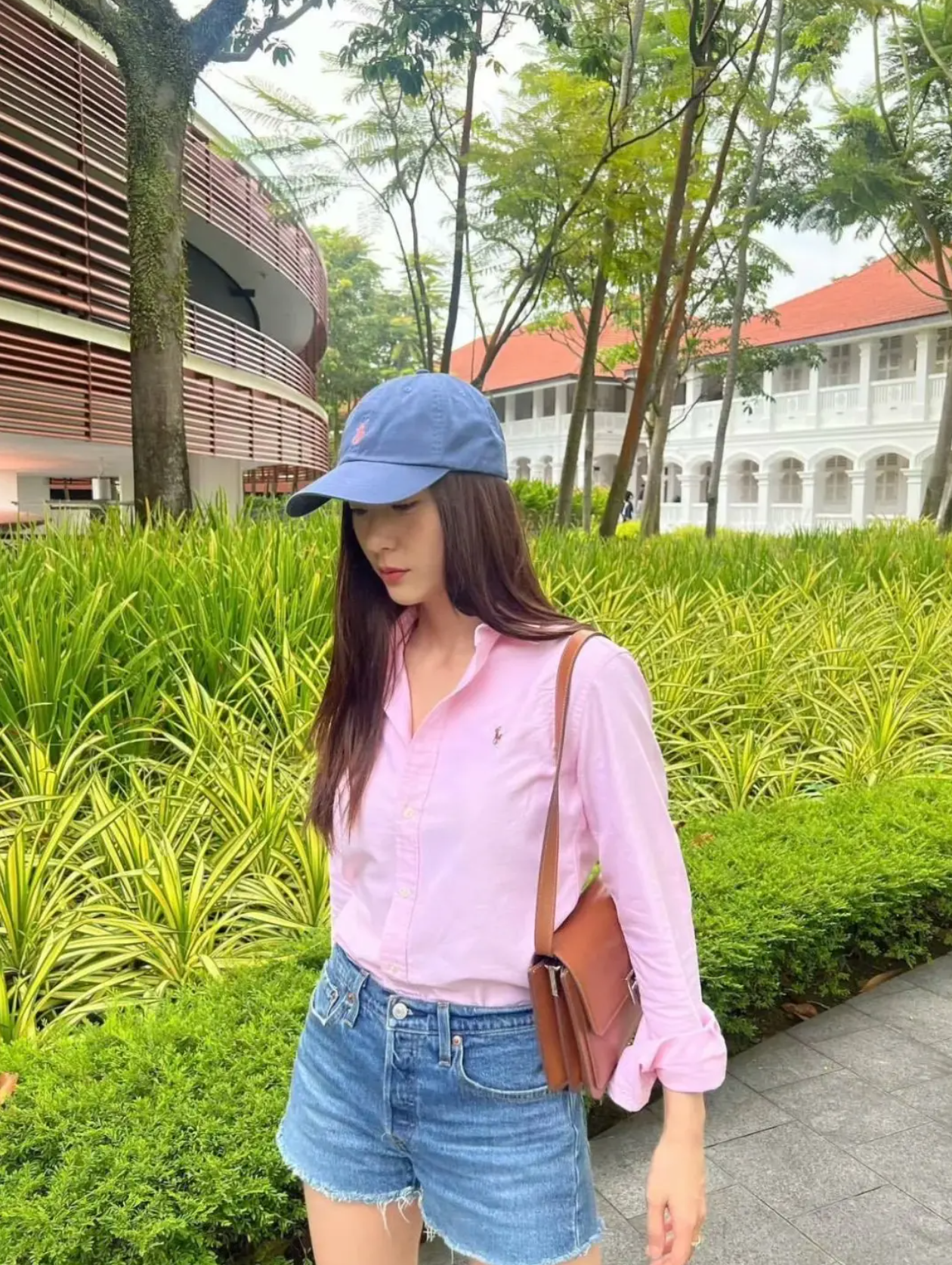 Krystal Jung in a soft blue button-down shirt showcasing the 2026 preppy spring trend