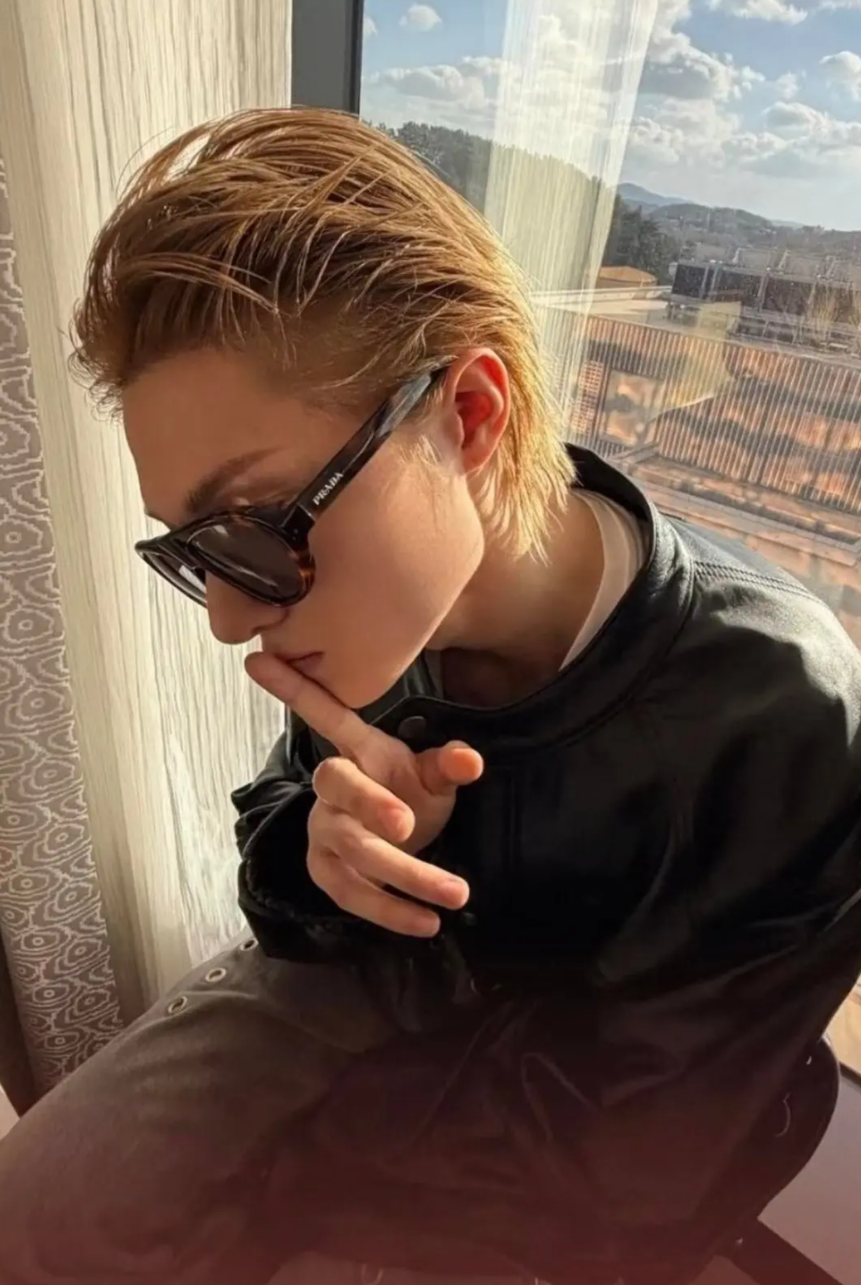 Model Martin wearing oversized aviator sunglasses