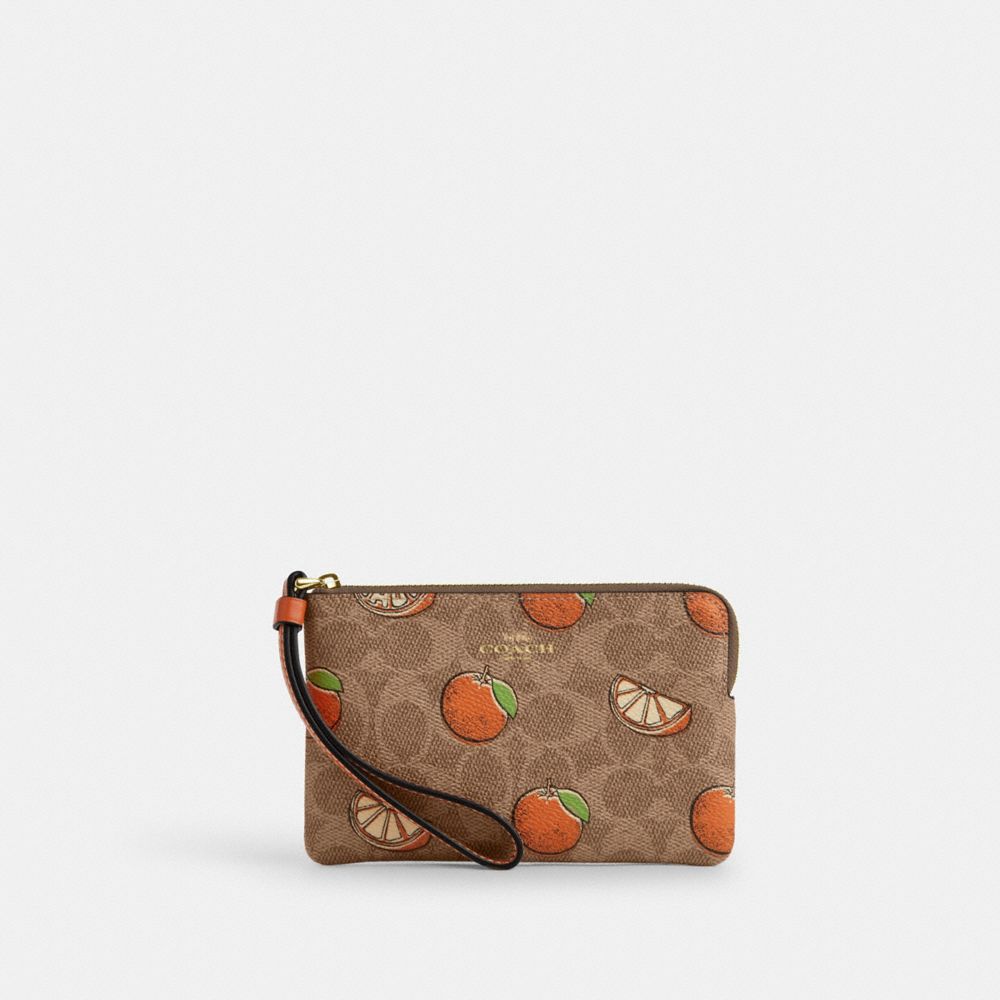 coach corner zip wristlet in signature canvas with orange print CBB82-IMTAM