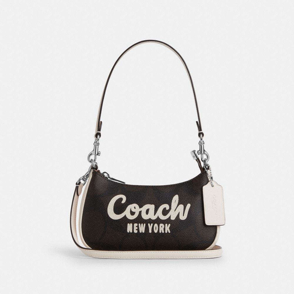 coach teri mini crossbody bag in signature canvas with coach graphic CY734-SVXIC