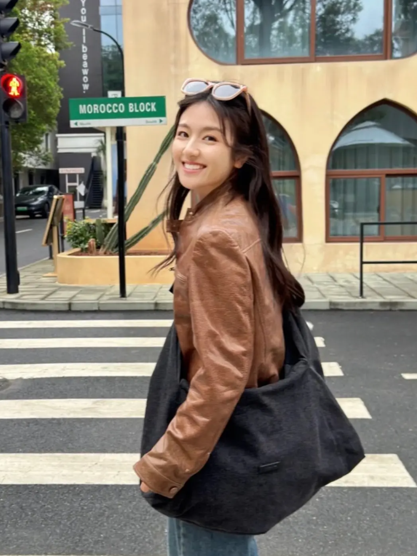 Li Landi in a chic funnel-neck jacket