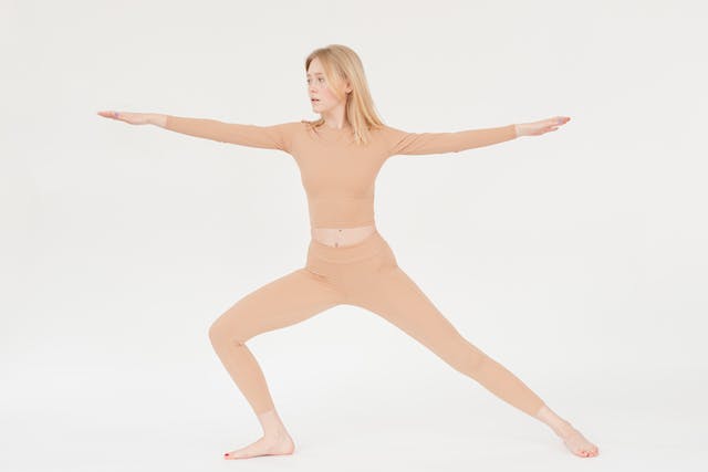 Woman stretching in high quality affordable leggings similar to Lululemon