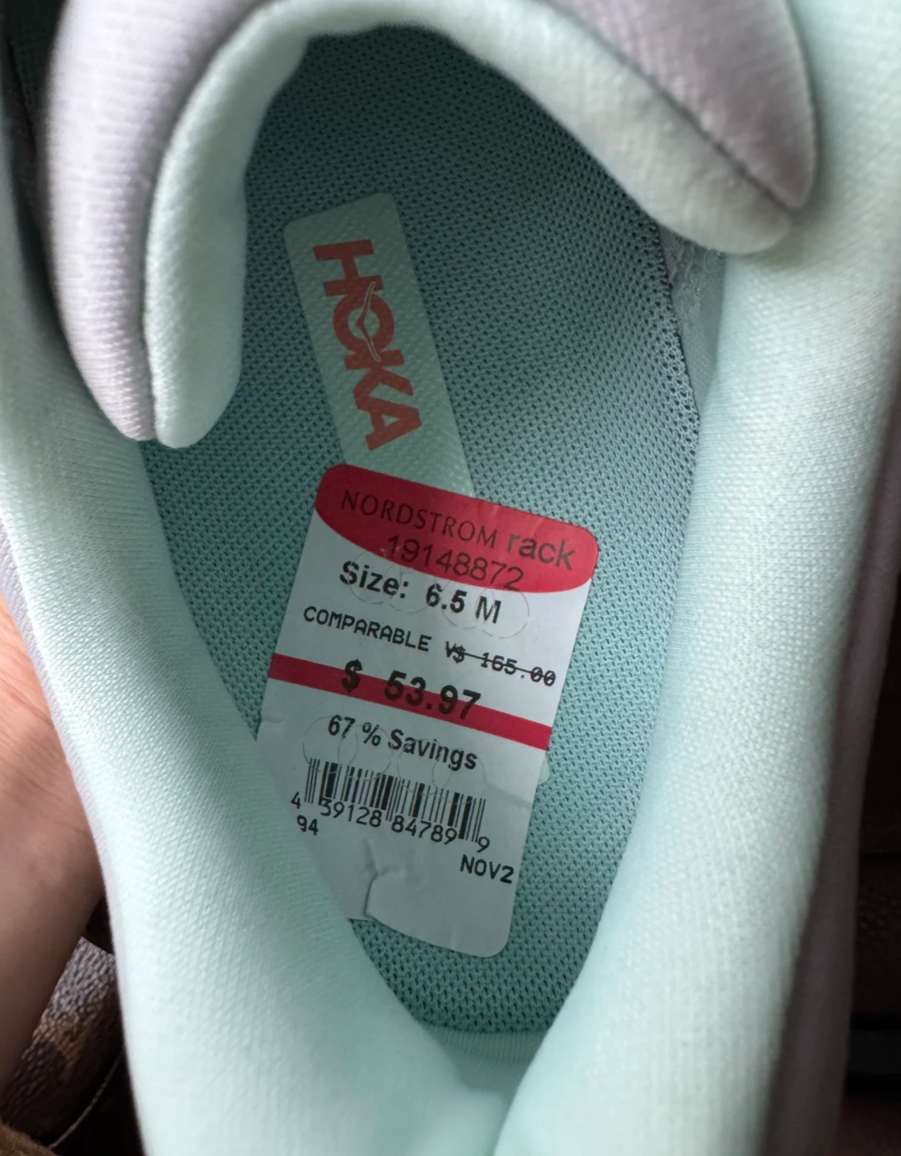 Trying on discounted Hoka shoes comfortable fit