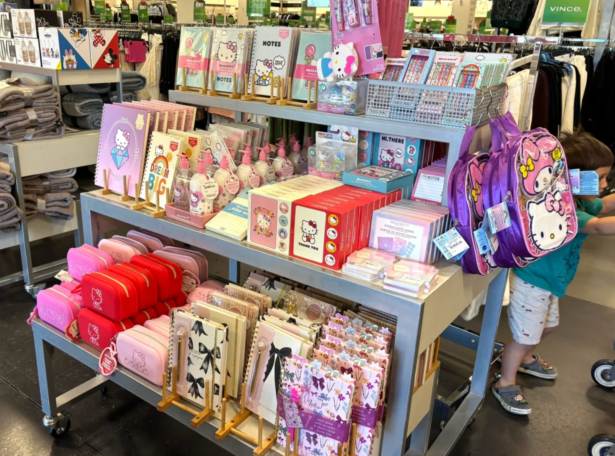 A wide shot of a Nordstrom Rack handbag section, showing rows of various designer bags on display, inviting shoppers.