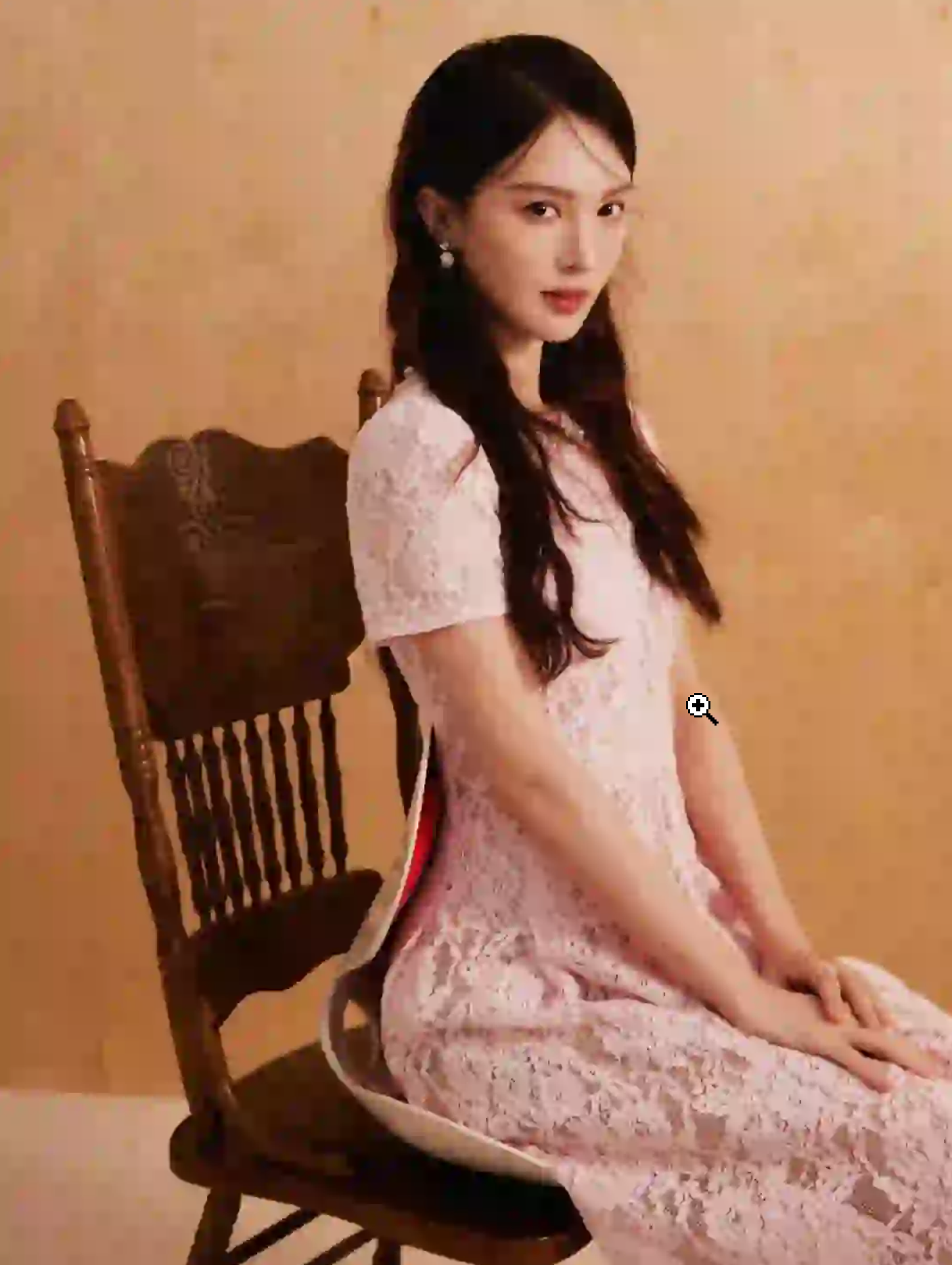 Jin Chen wearing elegant lace detailing outfit