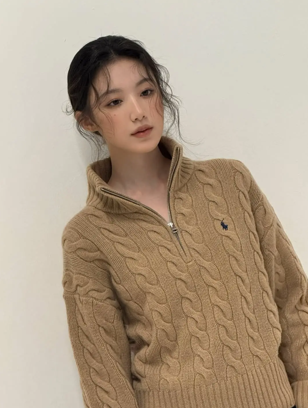 Shuhua wearing a grey 1/4 zip knit sweater for a sophisticated spring look