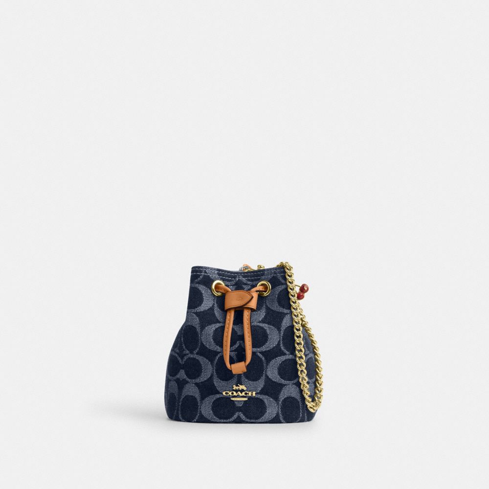 coach drawstring wristlet in signature denim CZ031-IMXIA