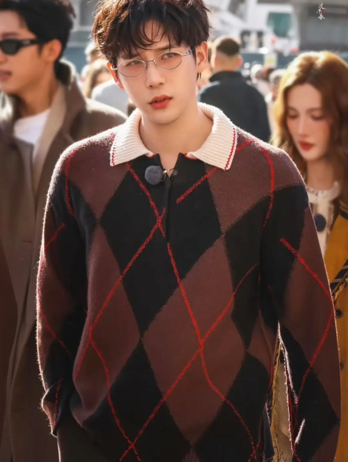 Wang Anyu in a stylish collared knit sweater